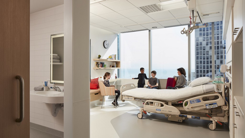A group of people in a hospital room.